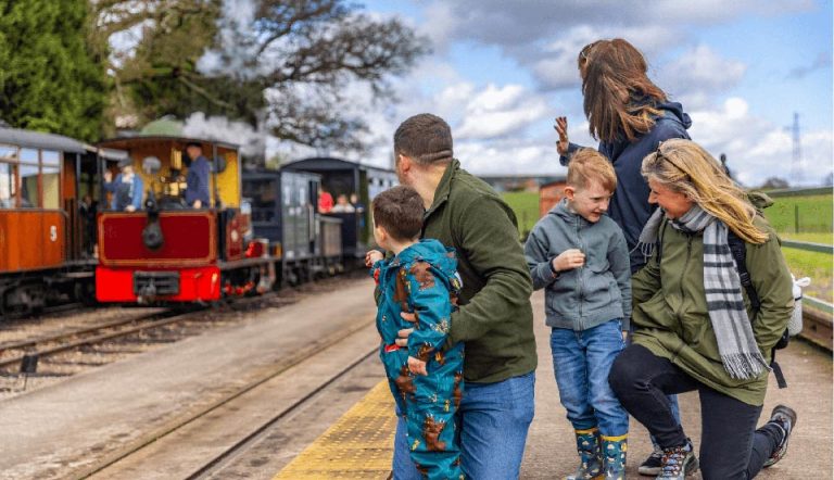 Family-waiting-for-train-at-platform