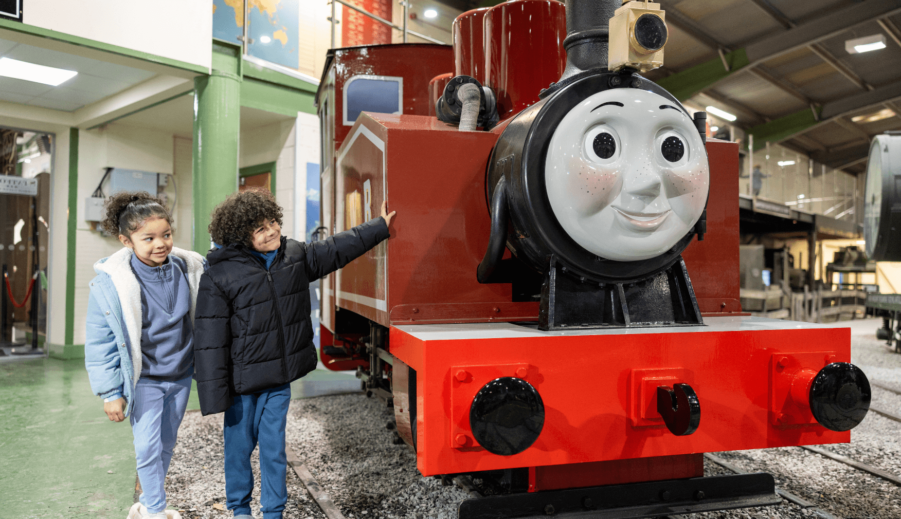 Brother and Sister looking at Rosie Engine