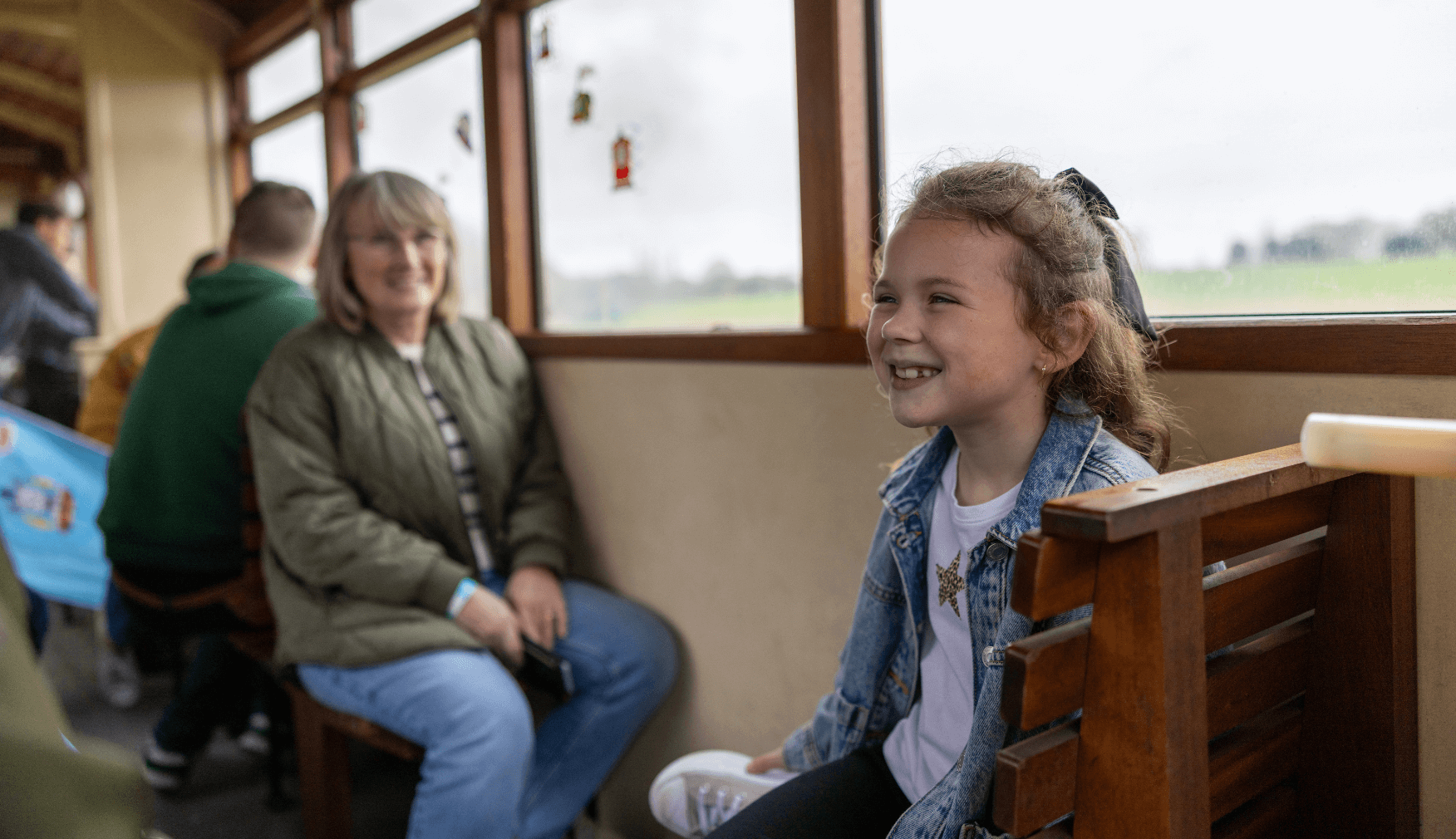 Girl with Family in train carriage at Statfold Day Out With Thomas