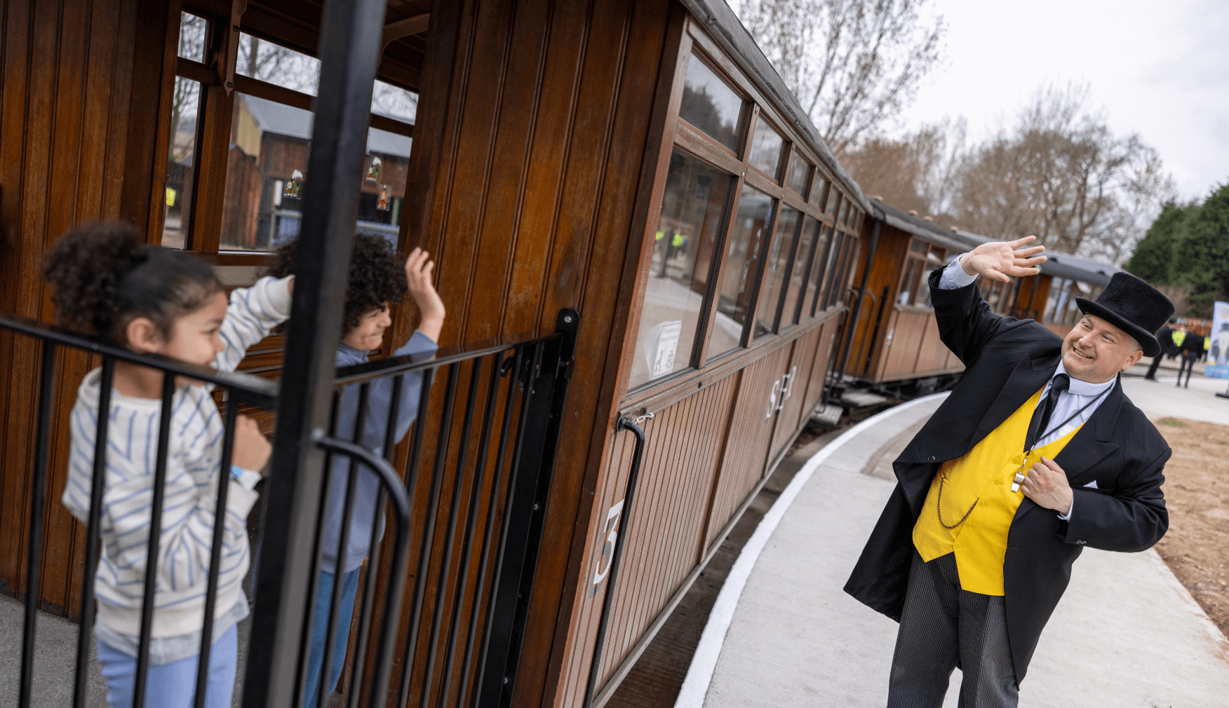 Kids waving at Sir Topham Hatt from Train at Statfold Country Park