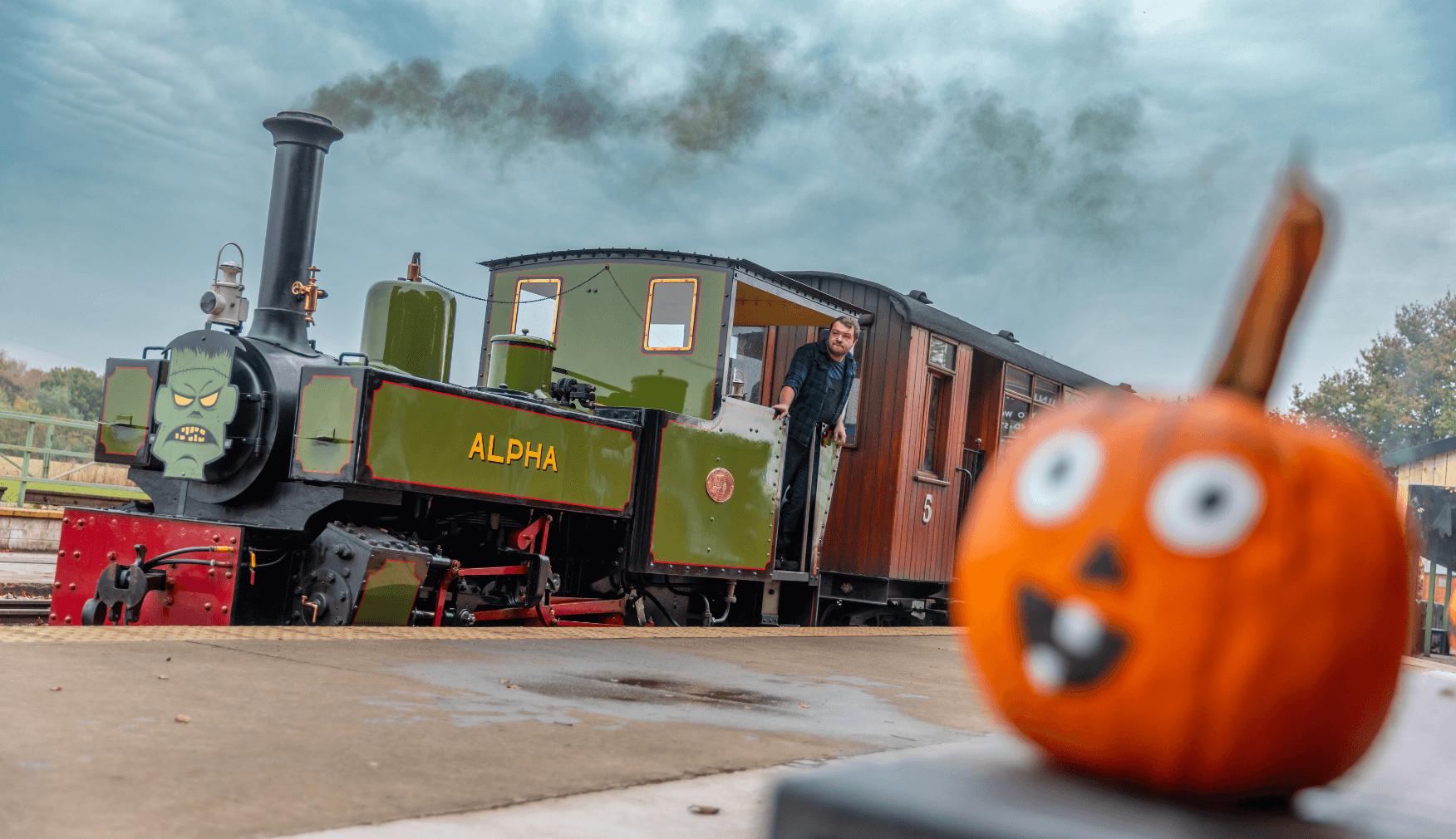 Alpha in steam next to a pumpkin