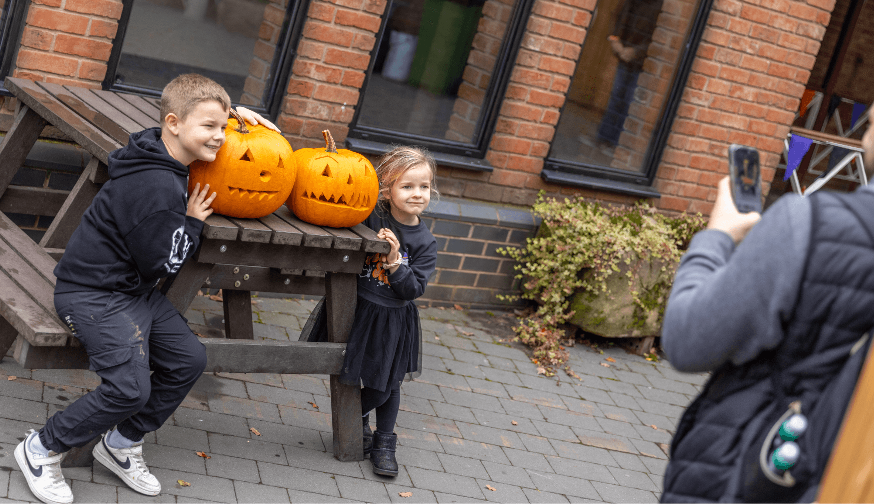 Kids Posing with Carved Pumpkins