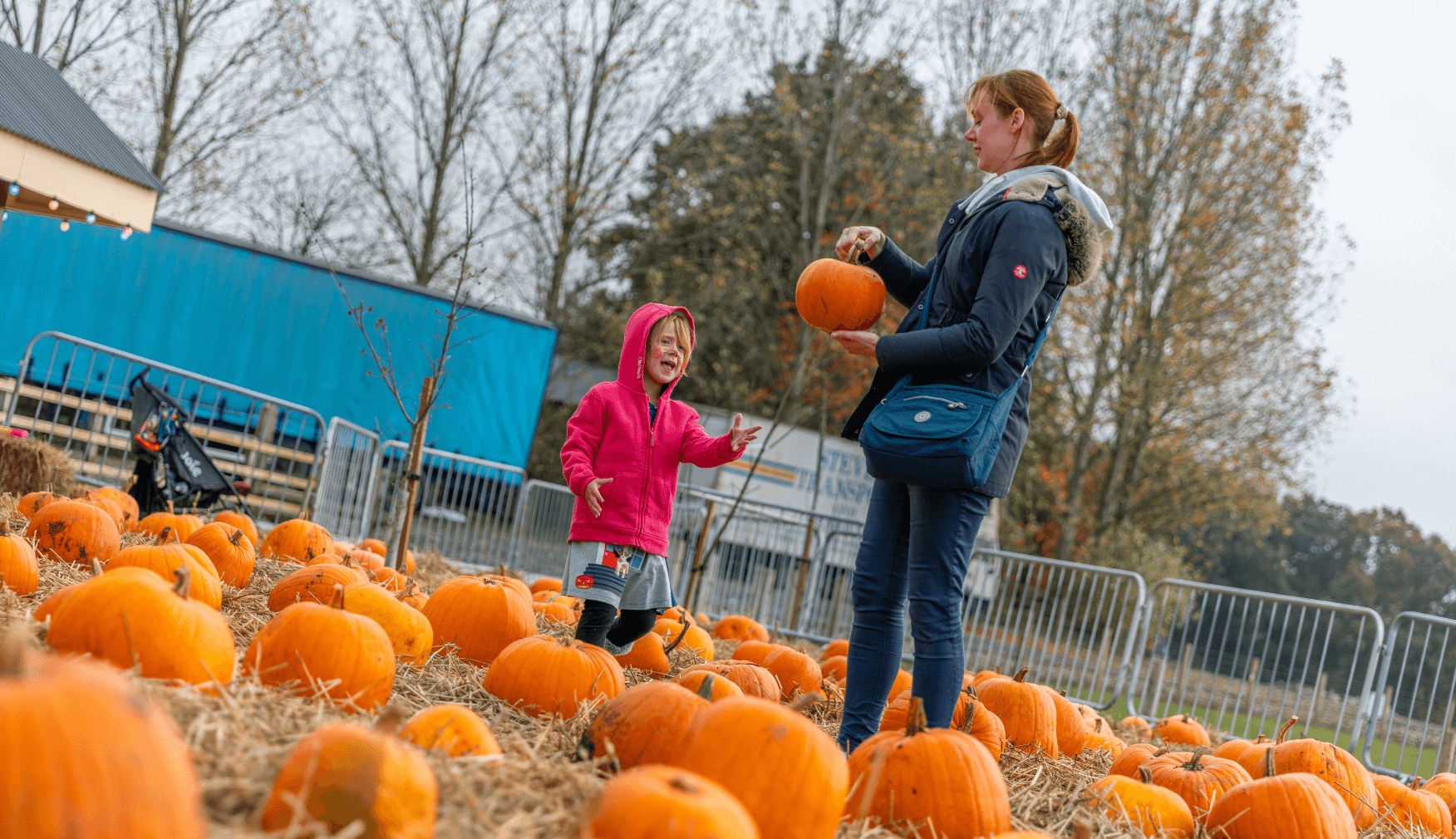 Mom and Daughter in the Pumpkin Patch
