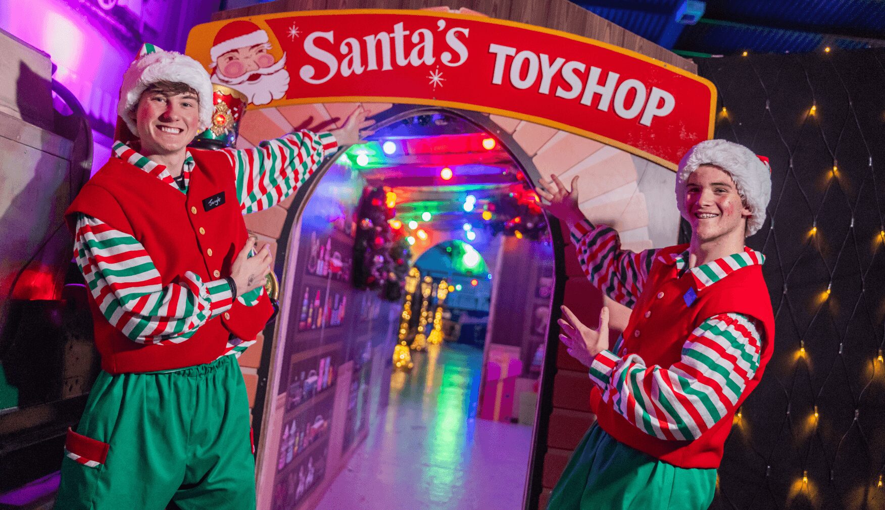 Elves showcasing entrance to the Toyshop