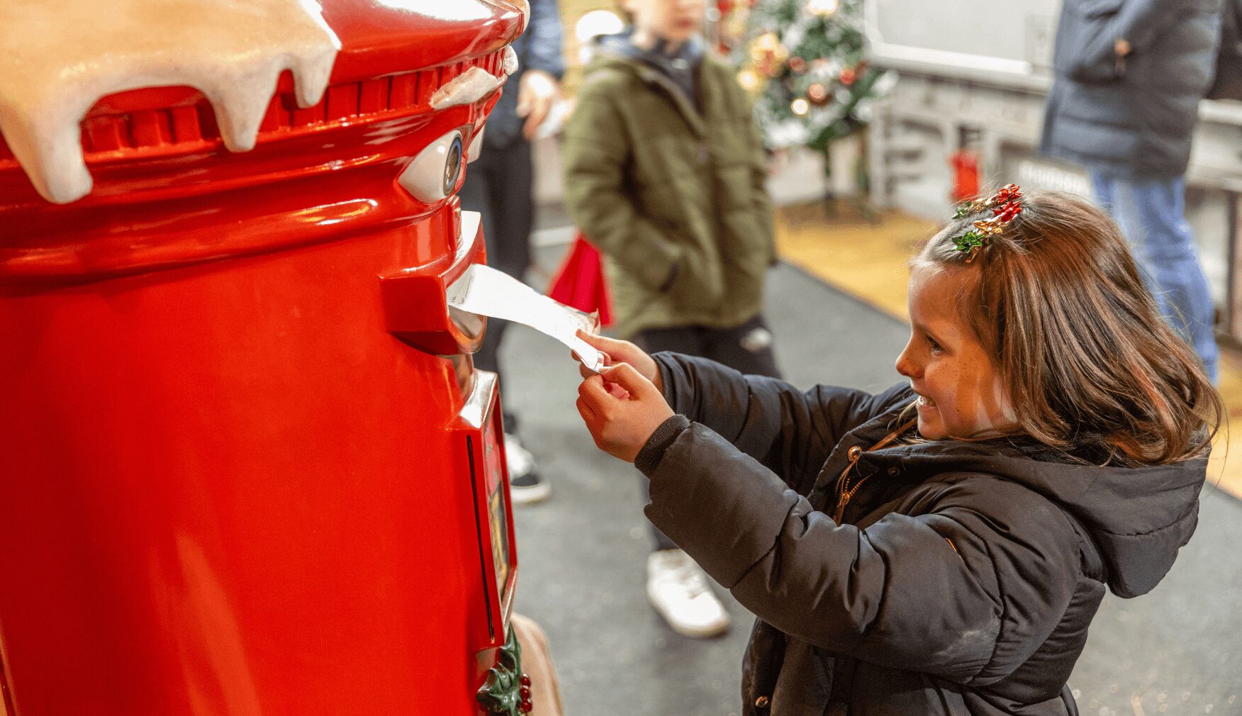 Girl posting letter in the Post Box at Statfold