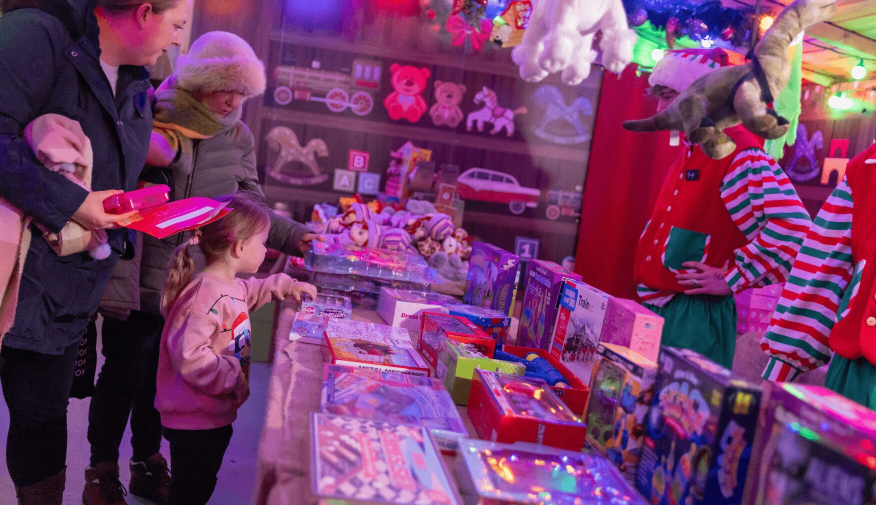 Little girl picking present in the Toy Shop at Statfold