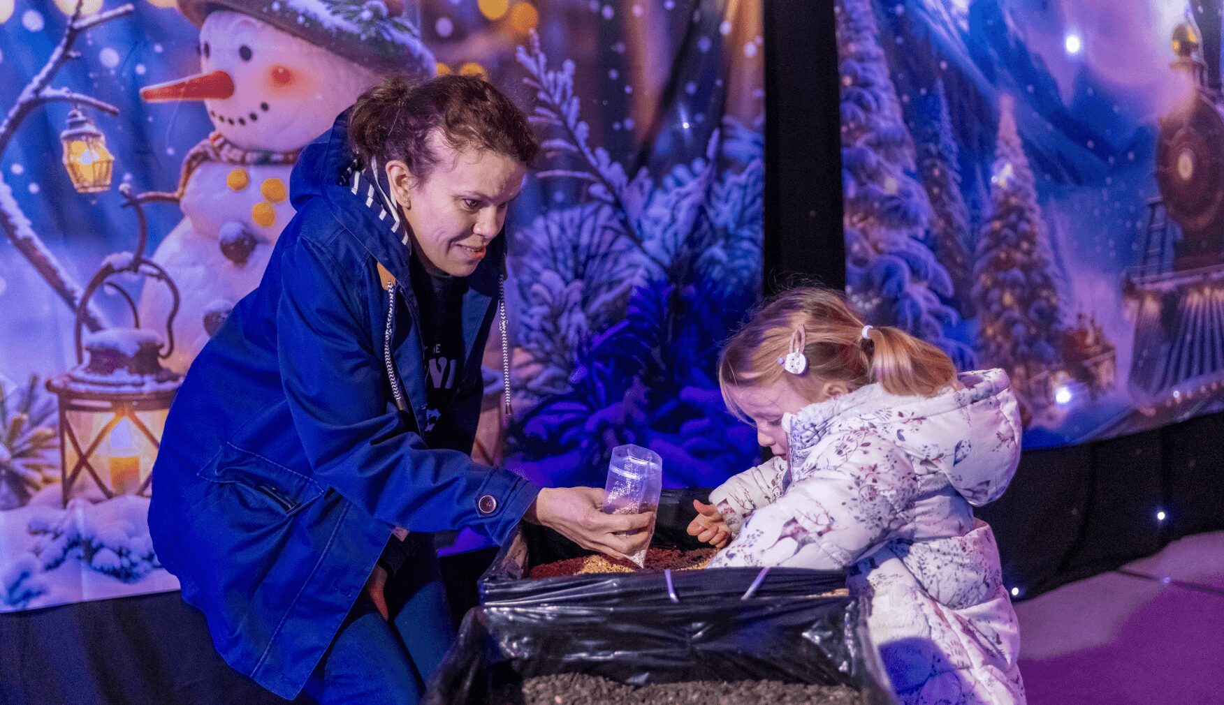 Mom and daughter making reindeer snacks at Statfold