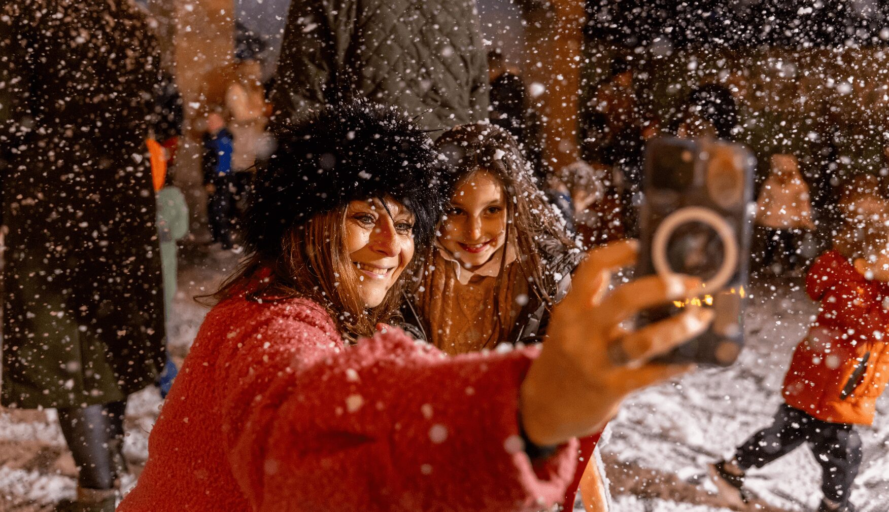 Mom taking selfie with daughter in the snow at Statfold