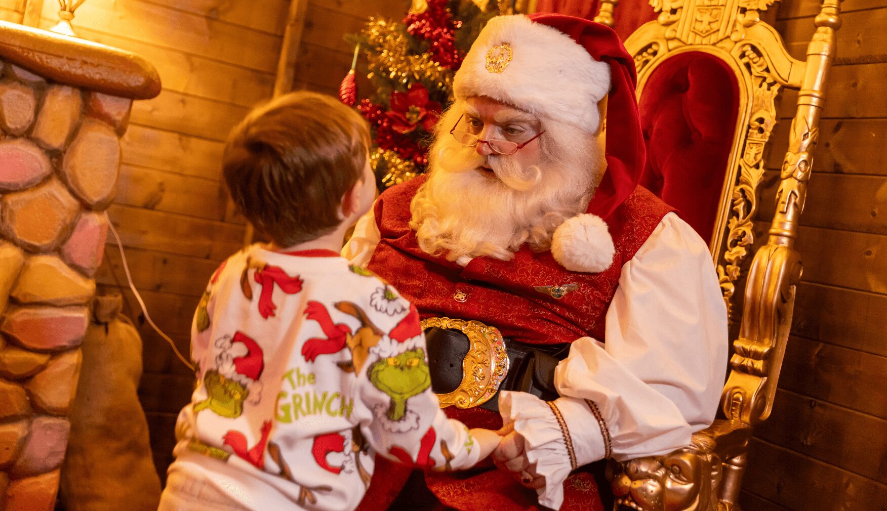 Santa meeting child in Statfolds Grotto